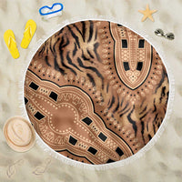 Round beach blanket with beige tiger-stripe print, tribal medallion, white fringe edge