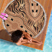 Round beach blanket with tiger-stripe and tribal motifs, white fringed edge