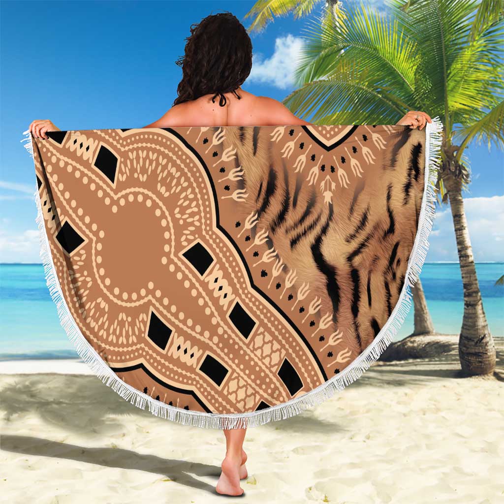 Round beach blanket featuring beige tiger-stripe print and tribal medallion, white fringe