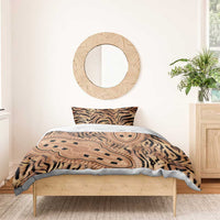 Tribal tiger-print bedding set on bed with two square matching shams and duvet