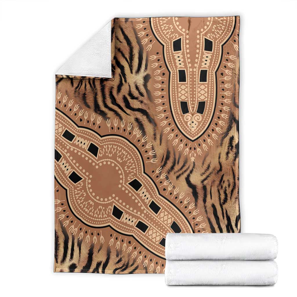 Folded brown and beige tiger-striped blanket with tribal medallion pattern