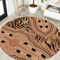 Round tribal pattern carpet with tiger stripes and medallion motif, beige and black