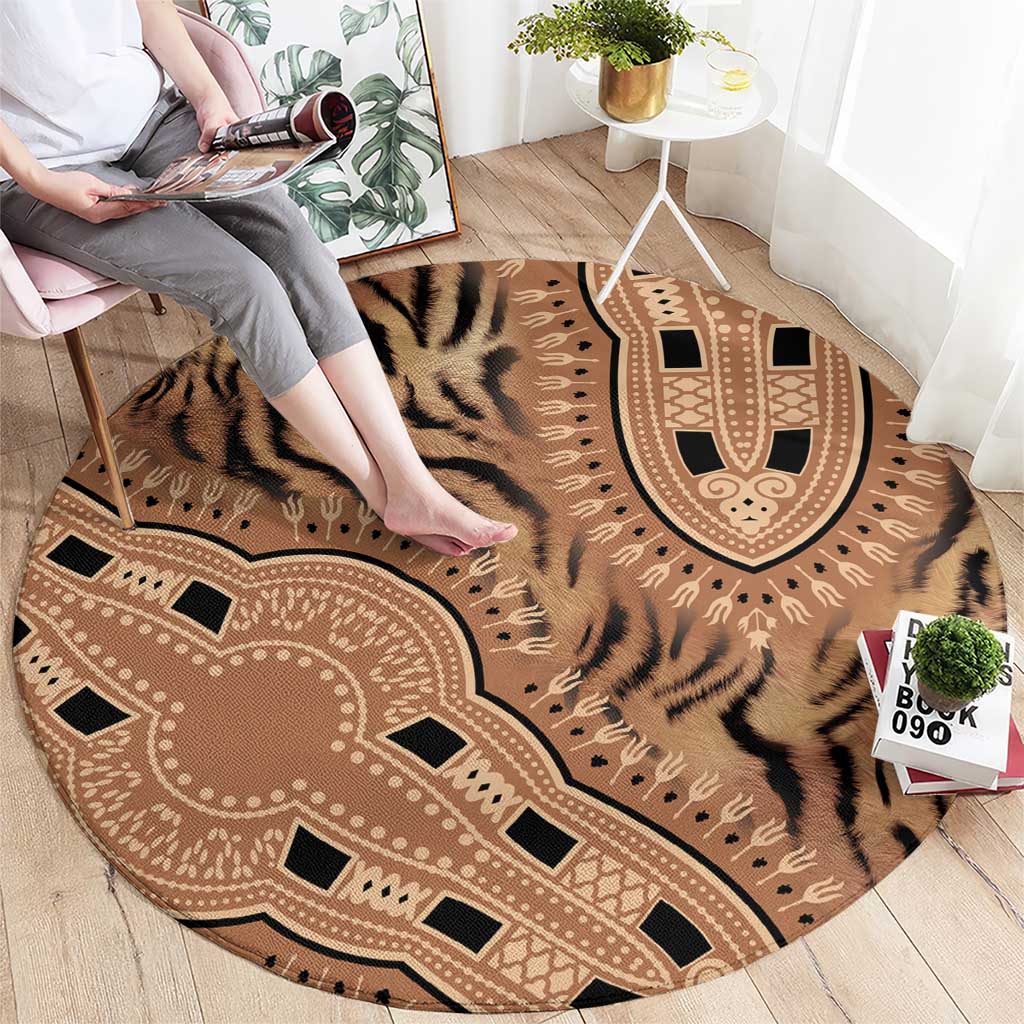 Round carpet laid flat with tiger stripe center and tribal border, beige and dark