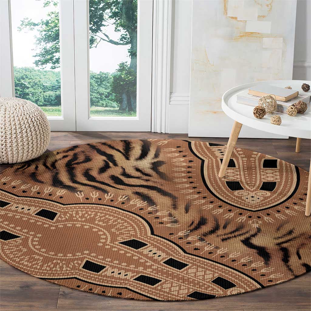 Round tribal tiger pattern carpet with medallion and geometric border, beige tones