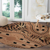 Round tribal tiger pattern carpet with medallion and geometric border, beige tones