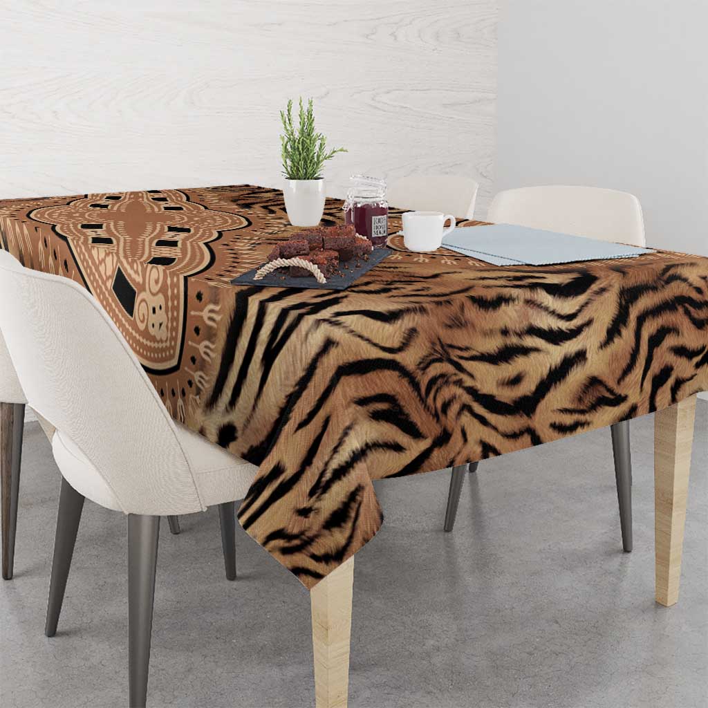 Beige and black tribal tiger print tablecloth on dining table with decor