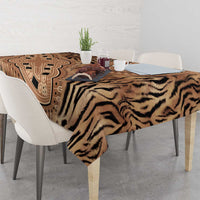 Beige and black tribal tiger print tablecloth on dining table with decor