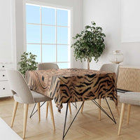 Beige and black patterned tablecloth with tiger stripes on dining table