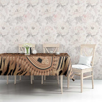 Beige and black tiger tribal pattern tablecloth on dining table with chairs