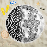 Round white beach blanket with zebra stripes and black paisley pattern, fringed edge