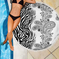 Round fringed beach blanket with zebra stripe and paisley design in black and white