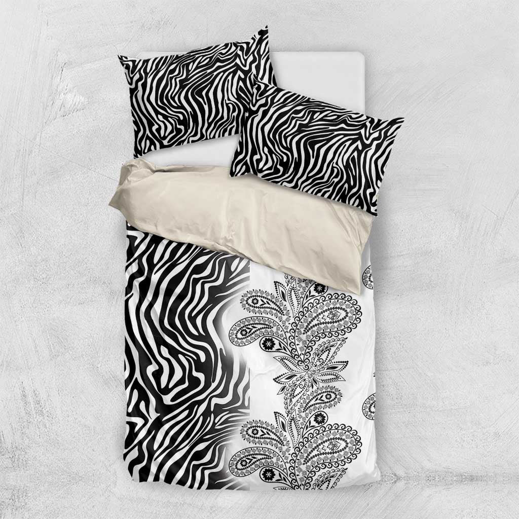 Black and white bedding set with zebra stripe pattern and paisley floral panel on top