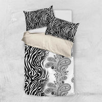 Black and white bedding set with zebra stripe pattern and paisley floral panel on top
