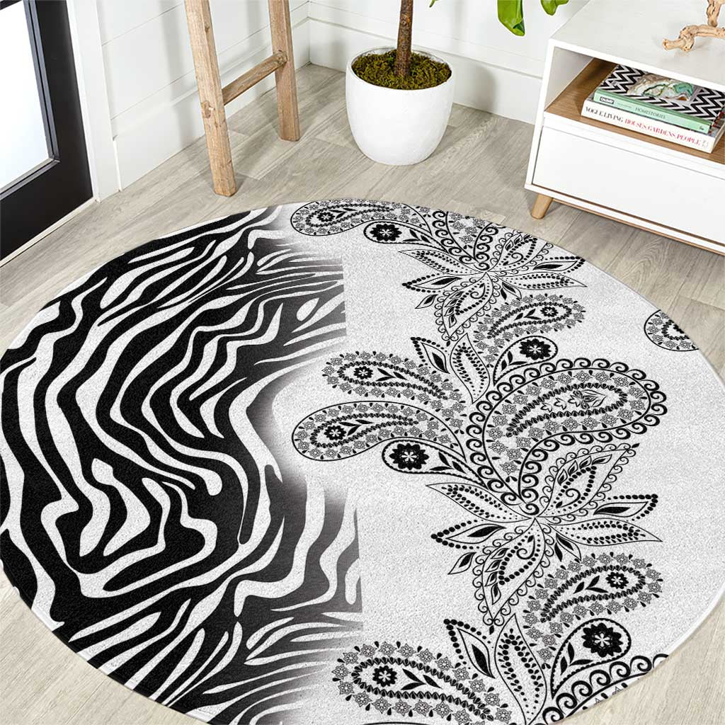 Round carpet with zebra stripes and paisley floral mandala pattern, black and white