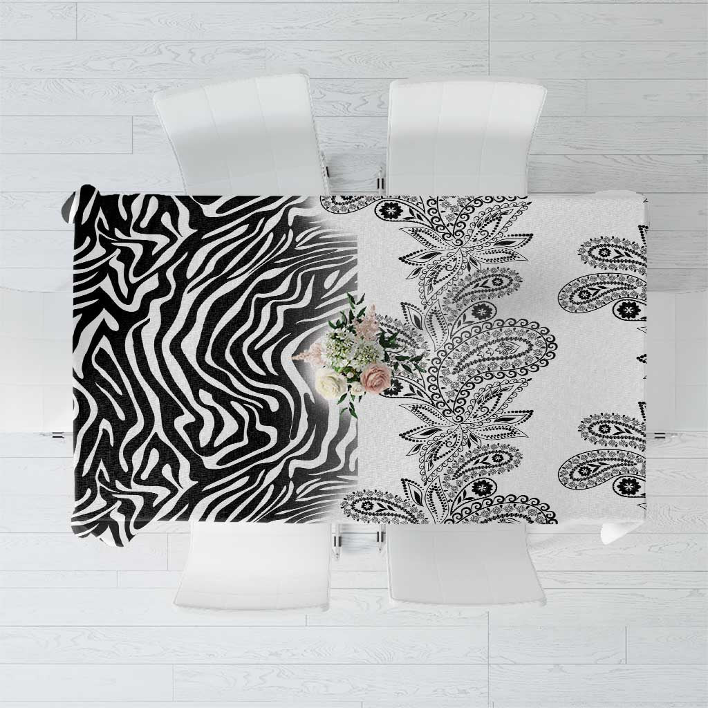 White tablecloth with black zebra left panel and paisley right panel, top view