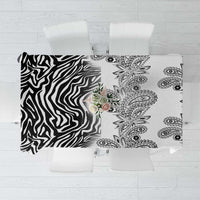 White tablecloth with black zebra left panel and paisley right panel, top view