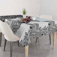 White tablecloth with black paisley and zebra pattern, draped over dining table