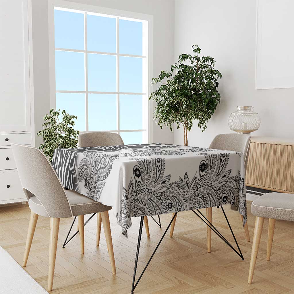 White tablecloth with black zebra and paisley tribal pattern, covering dining table