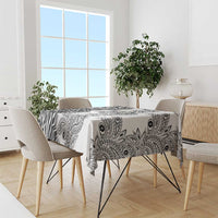 White tablecloth with black zebra and paisley tribal pattern, covering dining table