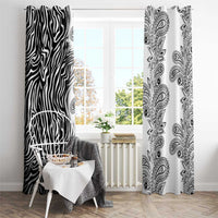 Zebra stripe and paisley patterned window curtains framing a bright window opening