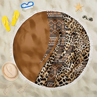 Round beach blanket with leopard print and tribal geometry, fringed border, brown and tan