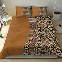 Gold and brown bedding set with leopard print center panel, tribal patterned strip, and two pillows