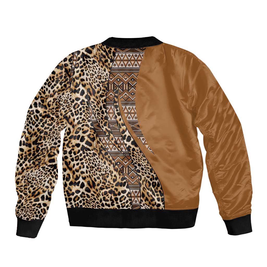 Gold bomber jacket with leopard print sleeves, tribal center panel, black ribbed hem and cuffs.