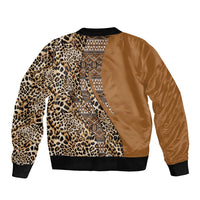 Gold bomber jacket with leopard print sleeves, tribal center panel, black ribbed hem and cuffs.
