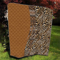 Quilt folded display: tan quilted side with leopard-print side and tribal border panel