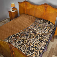 Bedspread quilt with tan quilted half and leopard-print half with tribal geometric strip
