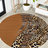 Round leopard print carpet with brown field and central tribal stripe pattern