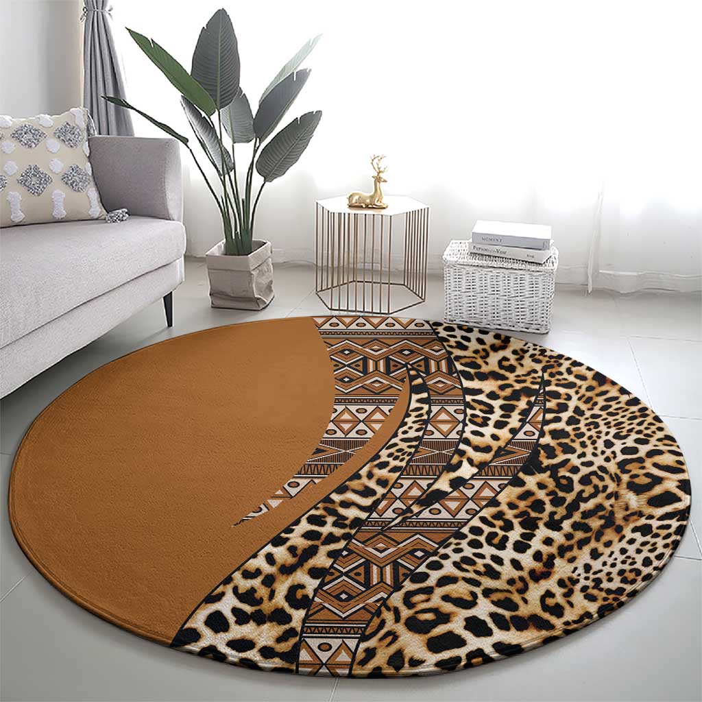Round leopard and tribal patterned carpet with tan geometric band and brown center