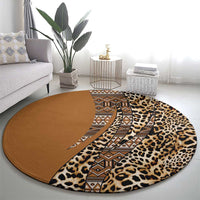 Round leopard and tribal patterned carpet with tan geometric band and brown center