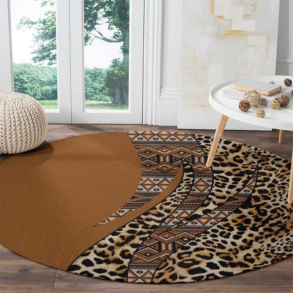 Round leopard and tribal patterned carpet with brown base and tan geometric border