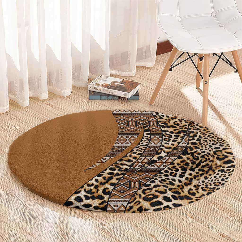 Round leopard and tribal patterned carpet with brown ground, tan spots, and zigzag band