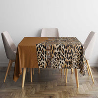 Gold leopard tablecloth with tribal motif runner on table corner