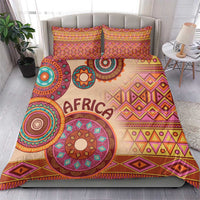 Beige tribal bed cover with large circular medallion design and two matching pillow shams