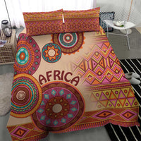 Beige tribal bed cover set with bold geometric pattern and two matching pillow shams