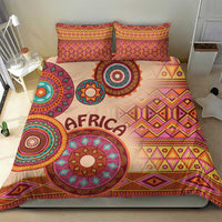 Beige African tribal bed cover set with vibrant geometric and circular motifs, two pillow shams
