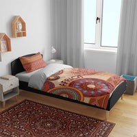 Beige African tribal bed cover set with vibrant circular medallion motif and two pillow shams