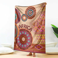 Beige Africa tribal pattern blanket with bold circular medallions, geometric shapes, 'AFRICA'