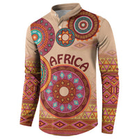 Beige tribal button sweatshirt with henley collar and long sleeves, large circular center motif