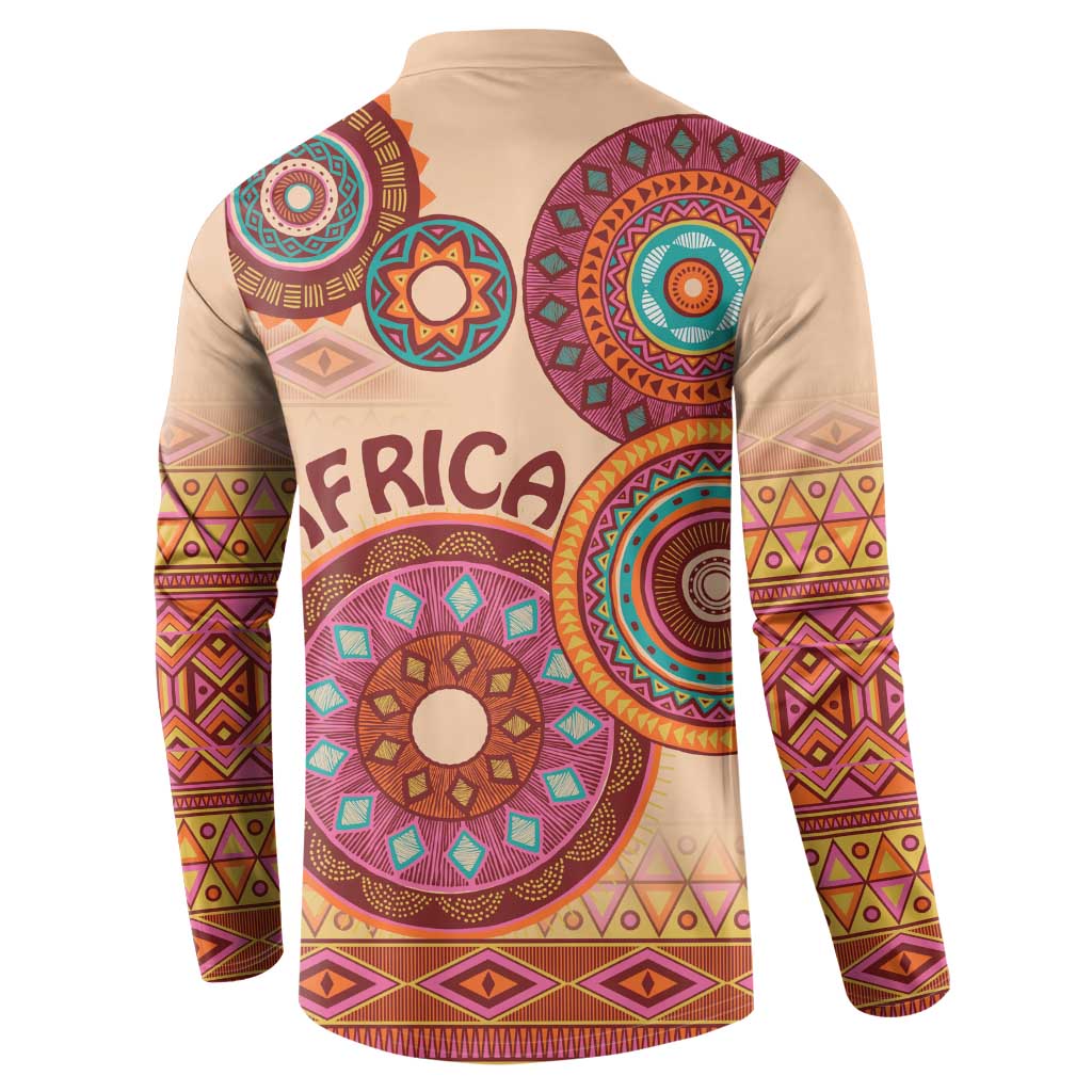 Beige tribal button sweatshirt with long sleeves and circular motif on back
