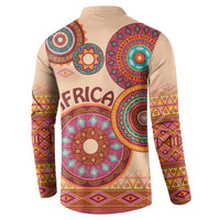 Beige tribal button sweatshirt with long sleeves and circular motif on back