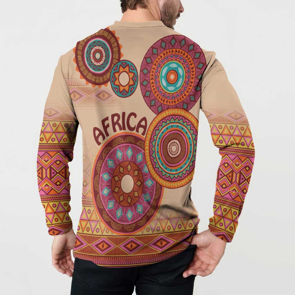 Beige tribal button sweatshirt with long sleeves and large circular motifs on back