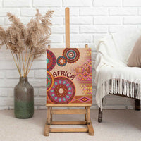 Beige canvas wall art on an easel with 'AFRICA' text and a large circular tribal mandala motif.