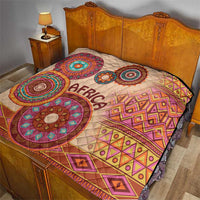 Beige bed quilt with 'Africa' center, large circular tribal prints and diamond borders
