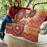 Beige tribal quilt with 'Africa' and circular medallion designs in purple and teal