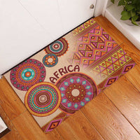 Beige corner rubber doormat with geometric zigzag border and multicolor circular motifs