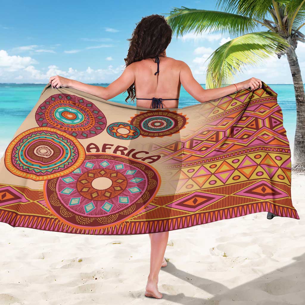 Beige tribal sarong with multicolor medallions, geometric diamonds, and "AFRICA" print